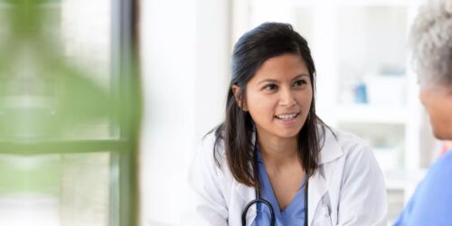 Oncologist speaking with breast cancer patient